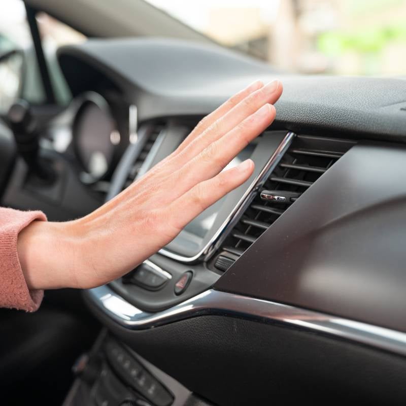 Mack Grubbs Hyundai in Hattiesburg MS customer holding their hand in front of vent after ac is charged